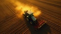 Aerial view of a Tractor fertilizing a cultivated agricultural field Royalty Free Stock Photo