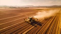 Aerial view of a Tractor fertilizing a cultivated agricultural field Royalty Free Stock Photo