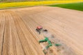 Aerial View. Tractor Plowing Field. Beginning Of Agricultural Spring Season. Cultivator Pulled By A Tractor In Royalty Free Stock Photo