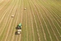 Aerial view of tractor with round baler on field