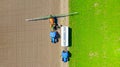 Aerial view on tractor with sprayer came for reload, herbicide and pesticide Royalty Free Stock Photo