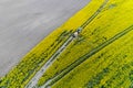 Aerial view on the tractor spraying the herbicide