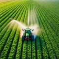 Aerial view of Tractor Spraying Pesticides on Green Soybean Plantation at