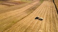 Aerial view of tractor working in the fields. Countryside agriculture working details