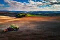 Aerial view of tractors working on the harvest field Royalty Free Stock Photo