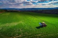 Aerial view of tractors working on the harvest field Royalty Free Stock Photo