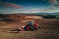 Aerial view of tractors working on the harvest field Royalty Free Stock Photo