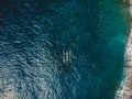 Aerial view of tradition balinese boat with turquoise ocean water Royalty Free Stock Photo