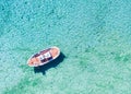 Aerial view of a traditional Greek fishing boat over turquoise sea in Greece Royalty Free Stock Photo