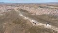 Aerial view of the traditional mills of Consuegra in Toledo, Spain. Forming a line to a castle with the town in the background Royalty Free Stock Photo