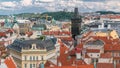 Aerial view of the traditional red roofs of the city of Prague, Czech Republic with the Powder tower and Vitkov Hill in