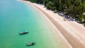 Aerial view of traditional Thai longtail fishin boats moored off a small, palm tree lined tropical beach (Khao Lak, Thailand Royalty Free Stock Photo