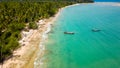 Aerial view of traditional Thai longtail fishin boats moored off a small, palm tree lined tropical beach (Khao Lak, Thailand Royalty Free Stock Photo