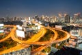 Aerial view traffic glowing on elevated road with skysccraper bu Royalty Free Stock Photo