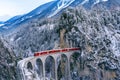 Aerial view of Train passing through famous mountain in Filisur, Switzerland. Landwasser Viaduct world heritage with train express