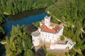 Aerial view of Trakoscan castle surrounded by the lake and forested hills Royalty Free Stock Photo