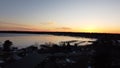 Aerial view of a tranquil lake illuminated by a vibrant sunset in Beaver Island, Michigan Royalty Free Stock Photo