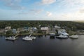 Aerial view of a fleet of boats docked peacefully at a marina in Saint Marys at sunrise