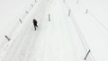 Aerial view traveler walking in the snow
