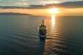 aerial view of trawler navigating through sea at dusk, with sun setting Royalty Free Stock Photo