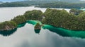 Aerial View Of Triton Bay In Raja Ampat Islands: Lagoon With Turquoise Water And Green Tropical Trees. Wide Angle Nature