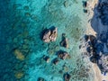 Aerial view of Tropea beach, crystal clear water and rocks that appear on the beach. Calabria, Italy. Swimmers, bathers floating