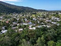 Aerial view of tropical housing estate around mountains in Queensland