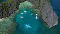 Tropical island with boats in lagoons Royalty Free Stock Photo