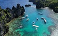 Tropical island with boats in lagoons Royalty Free Stock Photo