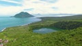 Aerial view of tropical Lake Tolire and volcano island in Ternate, Indonesia.