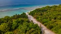 Aerial view of the tropical landscape with road, trees and ocean at the island Manadhoo the capital of Noonu atoll Royalty Free Stock Photo