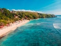 Aerial view of tropical sandy beach with crystal blue ocean in Bali. Drone shot Royalty Free Stock Photo