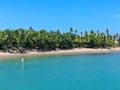 Aerial view of tropical white sand beach, palm trees and turquoise clear sea water in Praia do Forte Royalty Free Stock Photo