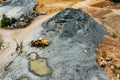 Aerial view of Truck excavator in open sand quarry rubble in Finland