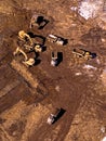 Aerial view of trucks carrying earth on a construction site Royalty Free Stock Photo