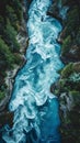 Aerial view of a turbulent river flowing through a forest