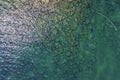 Aerial view of beautiful ocean. Aerial beach view and the rocky seaside. Sunny seashore seen from above. Royalty Free Stock Photo