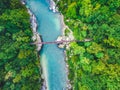 Aerial view of the turquoise blue Soca river and wooden bridge near Bovec in the Julian Alps in Slovenia. Royalty Free Stock Photo