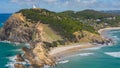 Aerial view of the turquoise waters and green hilly shore with the lighthouse. Byron Bay, Australia Royalty Free Stock Photo