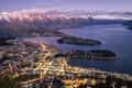 Aerial night view of twilight Queenstown and snow covered Remarkables, New Zealand