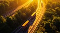 Aerial view of two cargo trucks driving through highway at sunset Royalty Free Stock Photo