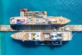 Aerial view of two giant cruise ships moored in the port of Philipsburg along with three barges, island of Sint Maarten. Royalty Free Stock Photo