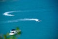 Aerial view of two jetskis and a ship sailing on the water Royalty Free Stock Photo