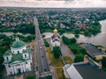 Aerial view of two old churches near river and bridge in small european city Royalty Free Stock Photo