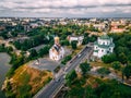 Aerial view of two old churches near river and bridge in small european city Royalty Free Stock Photo