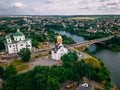 Aerial view of two old churches near river and bridge in small european city Royalty Free Stock Photo