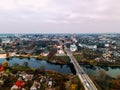 Aerial view of two old churches near river and bridge in small european city Royalty Free Stock Photo