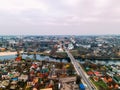 Aerial view of two old churches near river and bridge in small european city Royalty Free Stock Photo