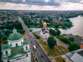 Aerial view of two old churches near river and bridge in small european city Royalty Free Stock Photo