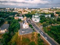 Aerial view of two old churches near river and bridge in small european city Royalty Free Stock Photo